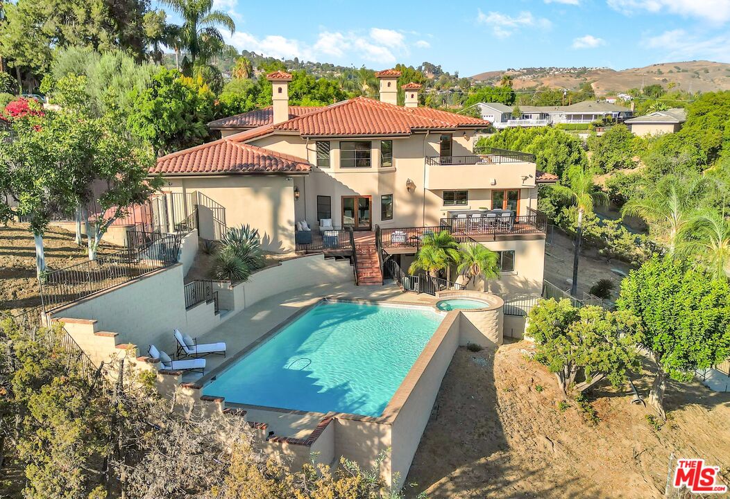 1405 Mayapan Road La Habra Heights, CA 90631 - Photo 49 of 54 a view of a patio with a table and chairs under an umbrella
