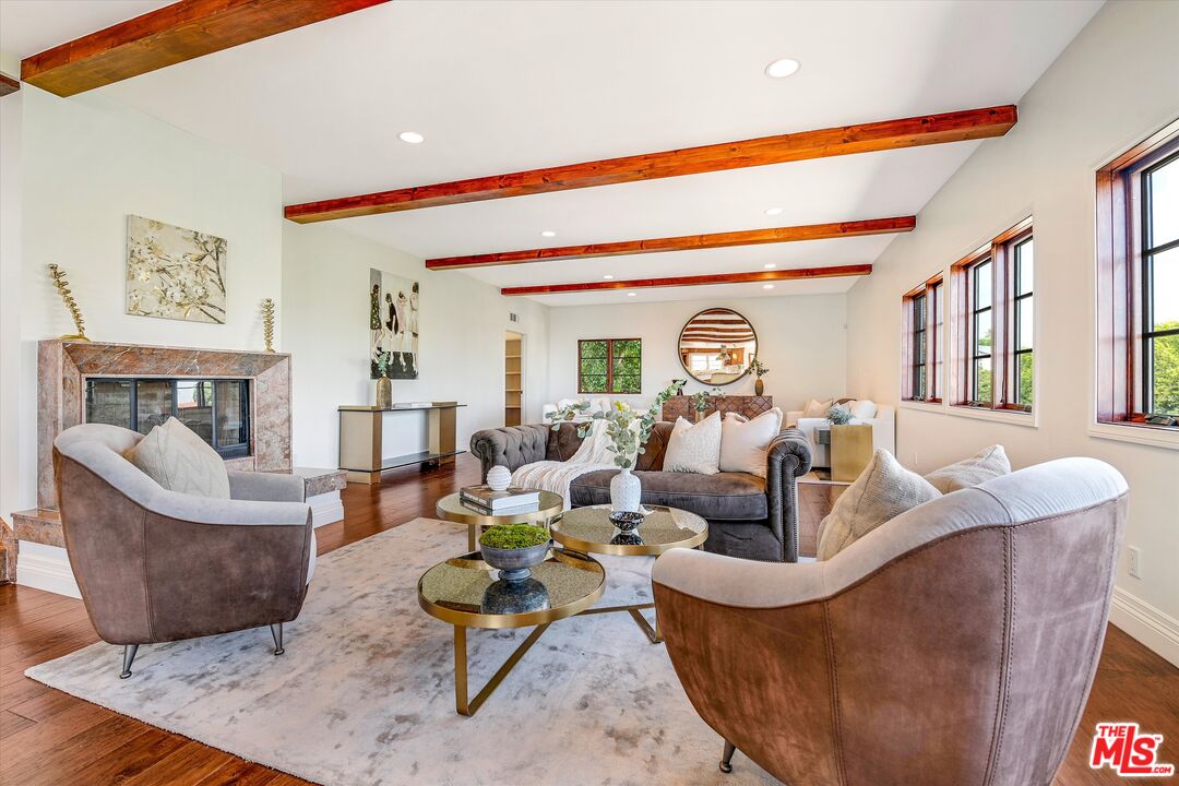 1405 Mayapan Road La Habra Heights, CA 90631 - Photo 9 of 54 a living room with fireplace furniture and a large window