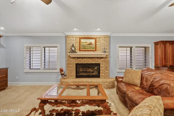 a large kitchen with kitchen island a sink a stove and a refrigerator
