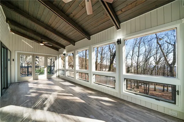 a view of an entryway with wooden floor