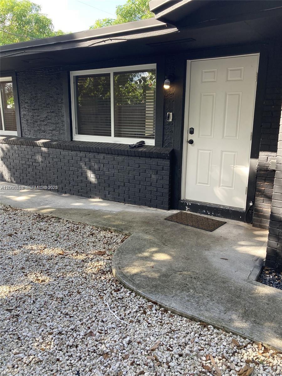 6132 Southwest 39th Street, Unit R Miramar, FL 33023 - Photo 1 of 21 a view of a house with a yard