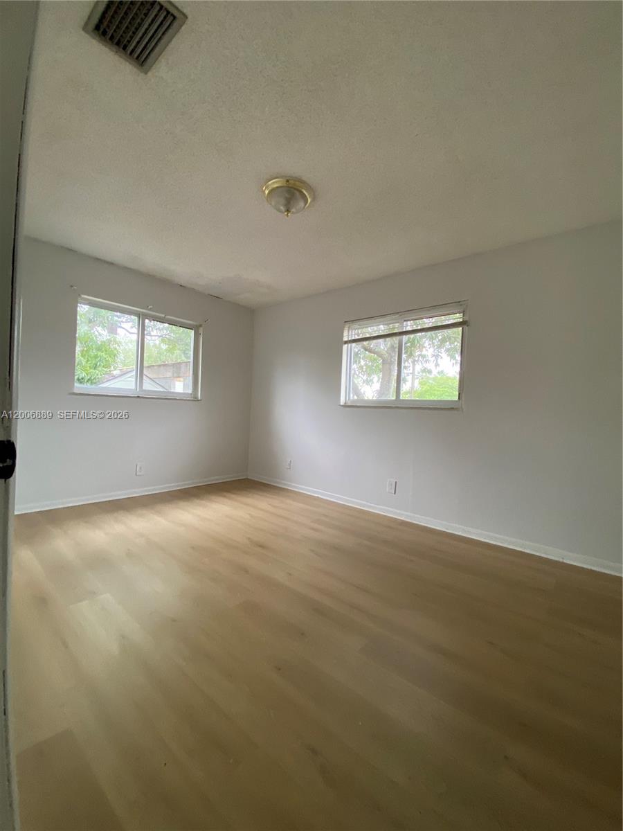 6132 Southwest 39th Street, Unit R Miramar, FL 33023 - Photo 13 of 21 an empty room with windows