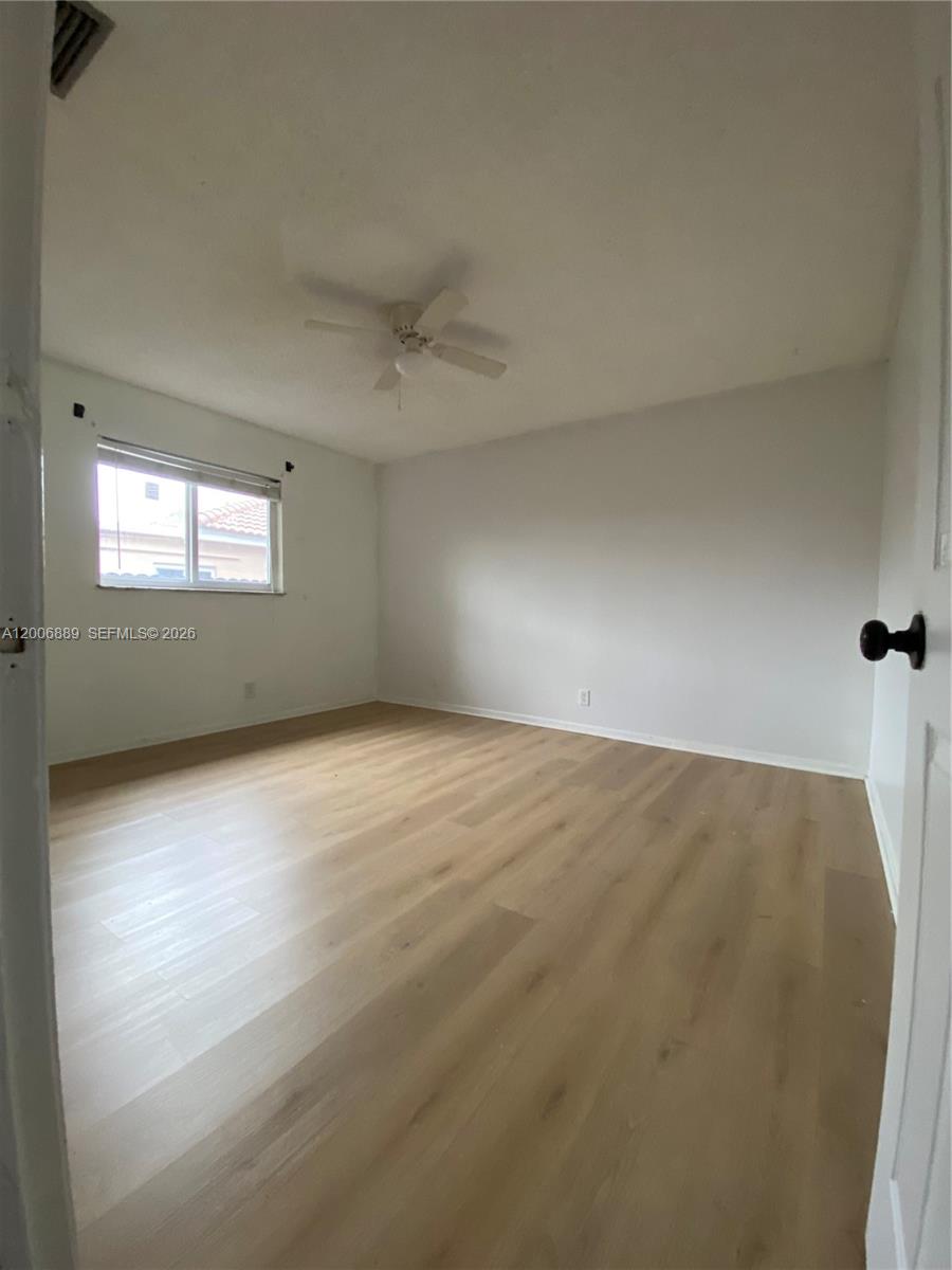 6132 Southwest 39th Street, Unit R Miramar, FL 33023 - Photo 16 of 21 an empty room with a empty space and windows