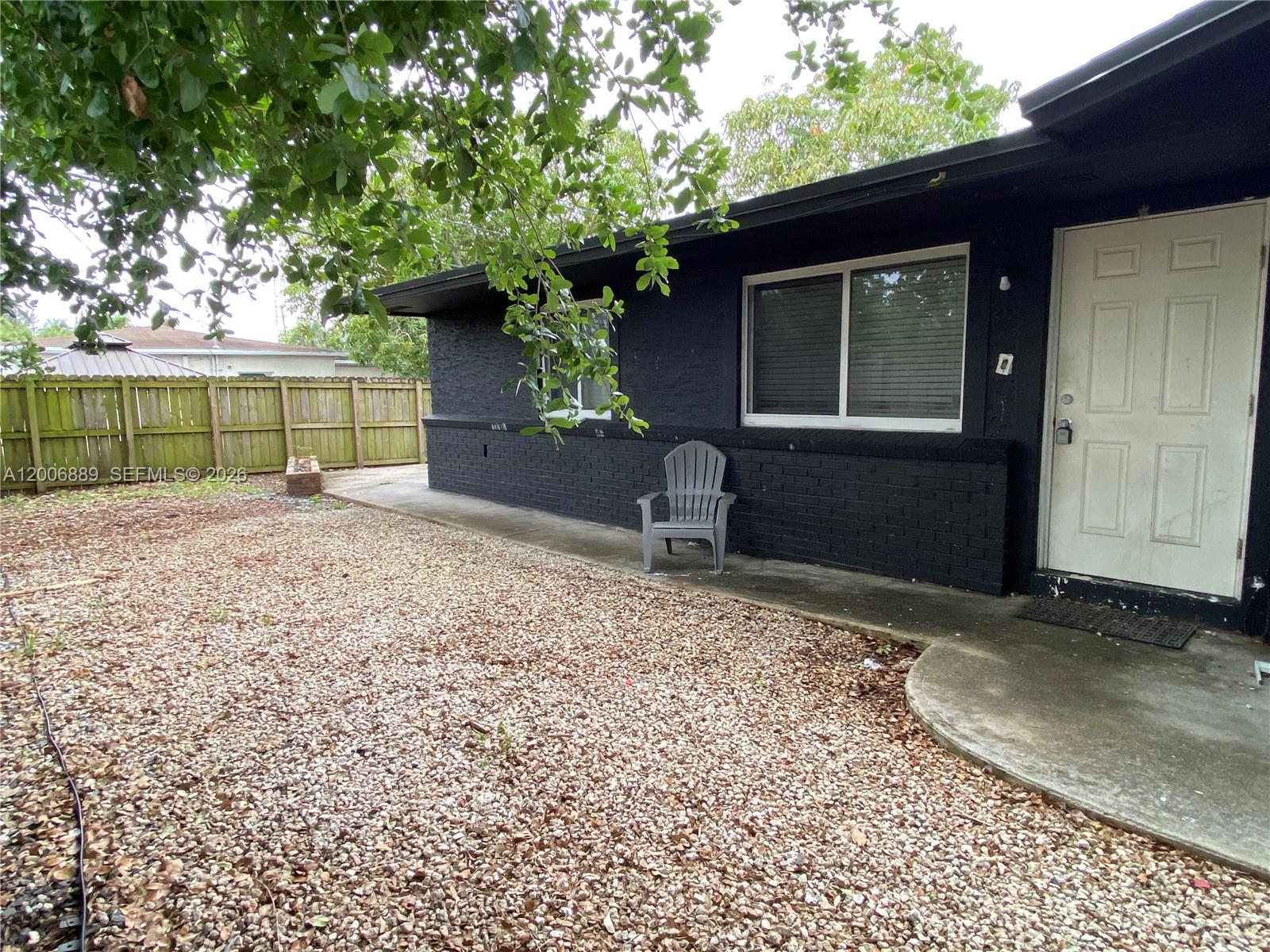 6132 Southwest 39th Street, Unit R Miramar, FL 33023 - Photo 4 of 21 a view of a backyard of a house