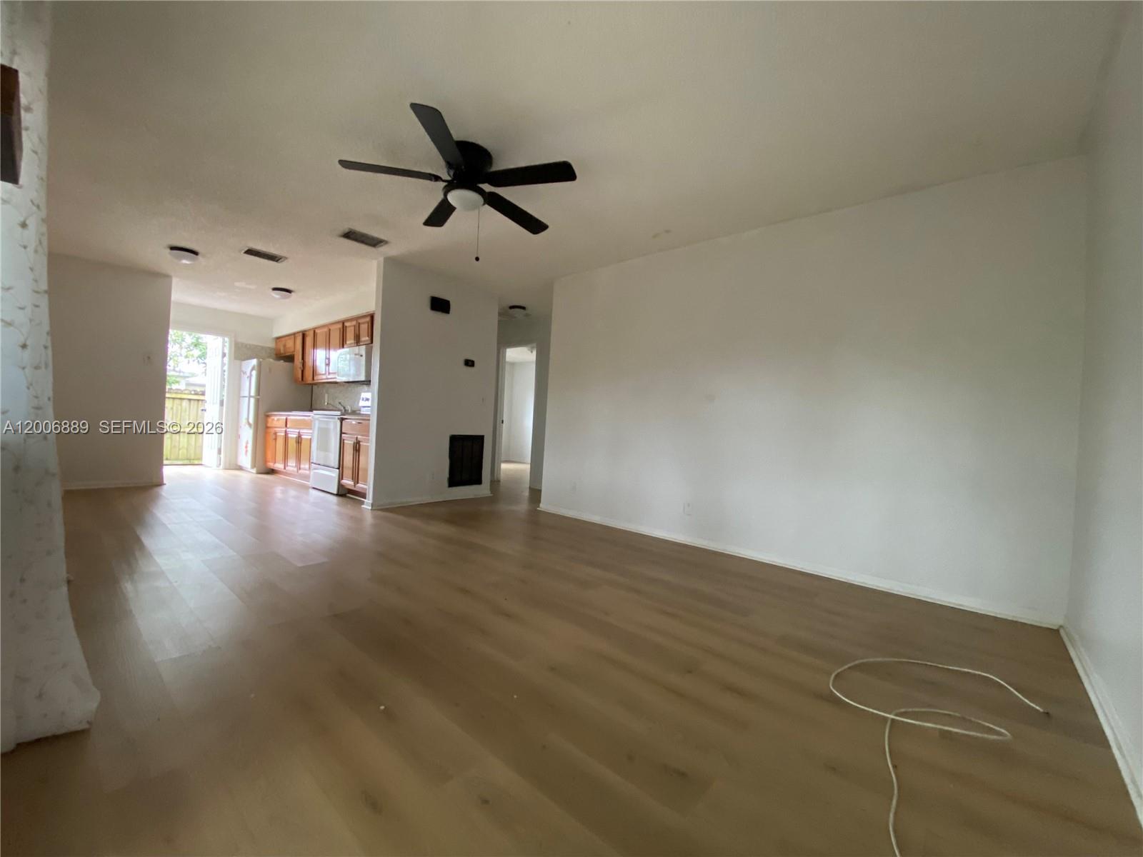 6132 Southwest 39th Street, Unit R Miramar, FL 33023 - Photo 5 of 21 a view of a livingroom with a fireplace