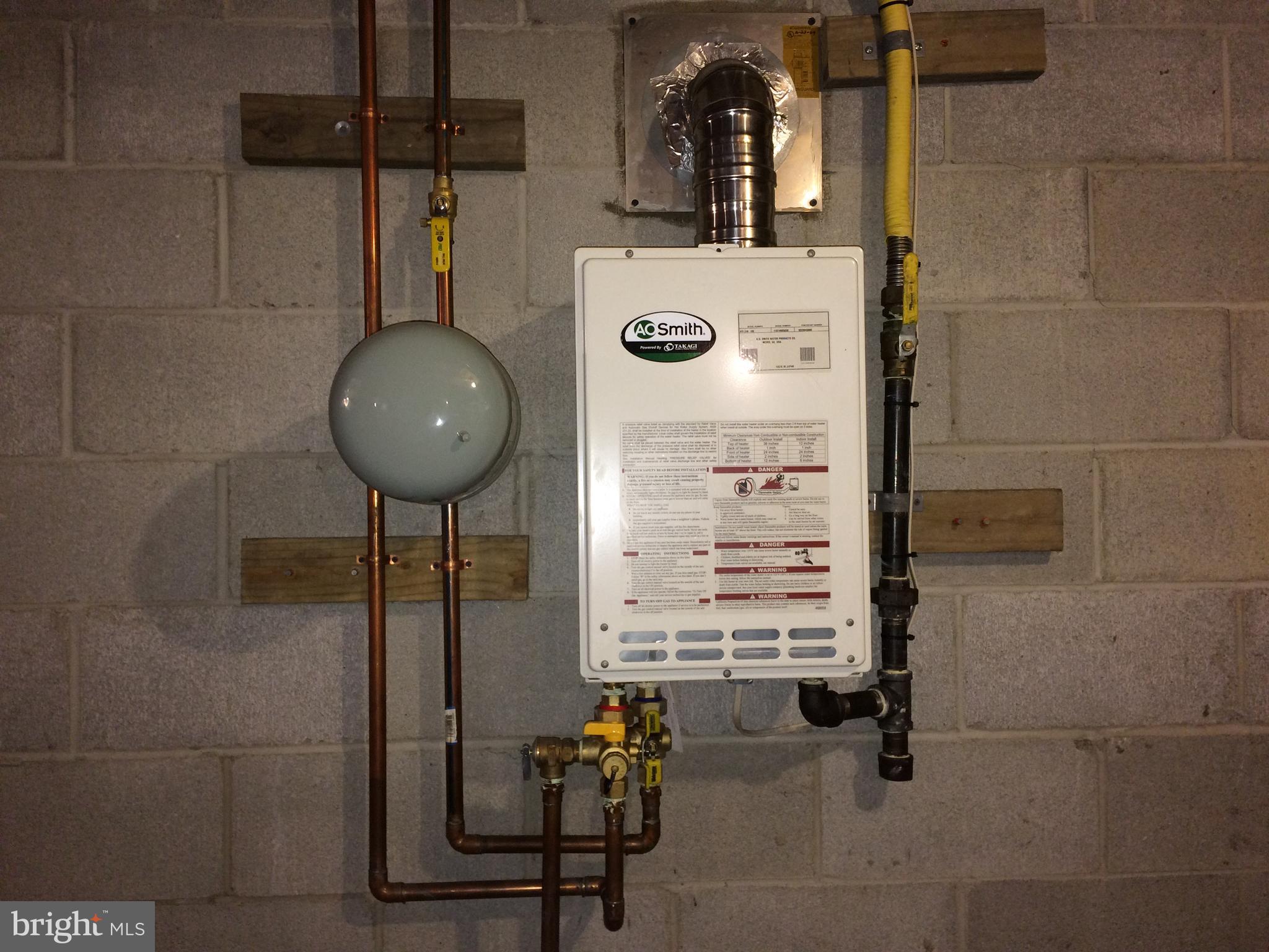 7805 Notley Road Pasadena, MD 21122 - Photo 20 of 30 Tankless water heater - gas