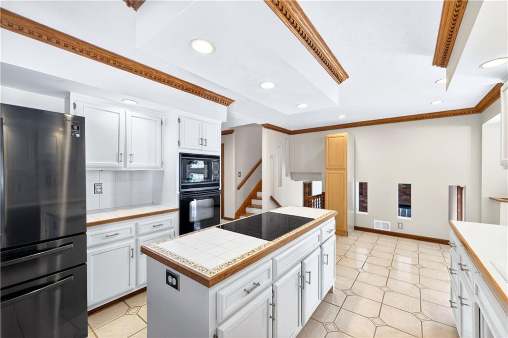 16 Ridgewood Drive McDonald, PA 15057 - Photo 13 of 47 a kitchen that has a cabinets and a stove top oven