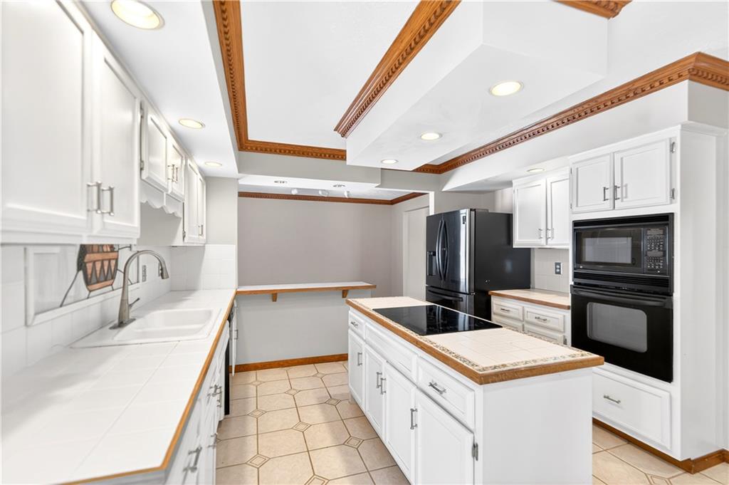 16 Ridgewood Drive McDonald, PA 15057 - Photo 14 of 47 a kitchen that has a sink and a stove in it