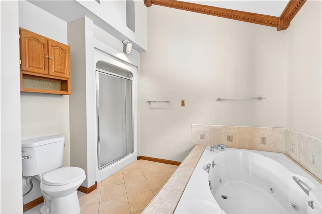 16 Ridgewood Drive McDonald, PA 15057 - Photo 30 of 47 a bathroom with a tub sink and toilet