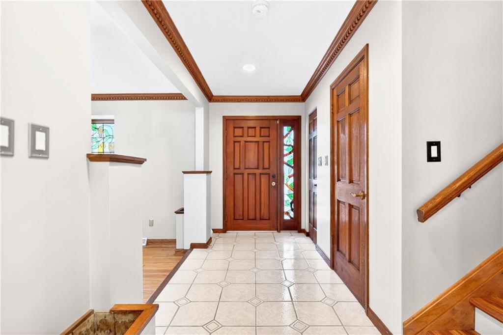 16 Ridgewood Drive McDonald, PA 15057 - Photo 3 of 47 a view of a hallway with wooden floor and staircase