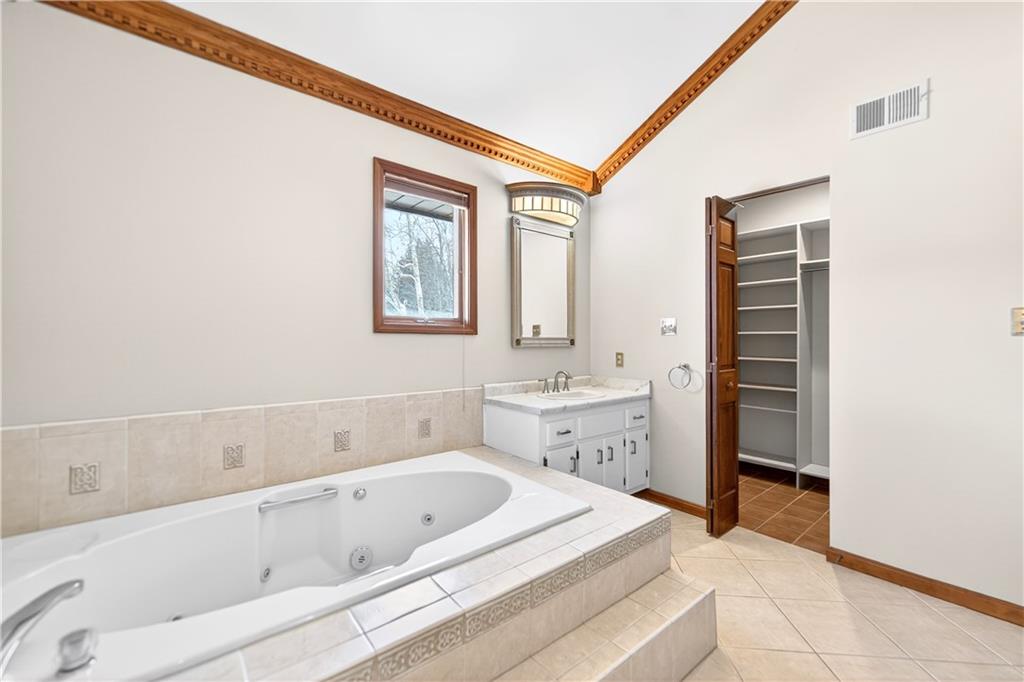 16 Ridgewood Drive McDonald, PA 15057 - Photo 31 of 47 a spacious bathroom with a tub sink and mirror