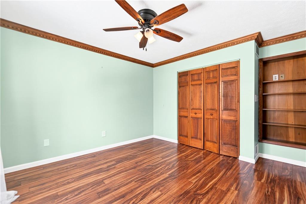 16 Ridgewood Drive McDonald, PA 15057 - Photo 33 of 47 an empty room with wooden floor closet chandelier fan and windows