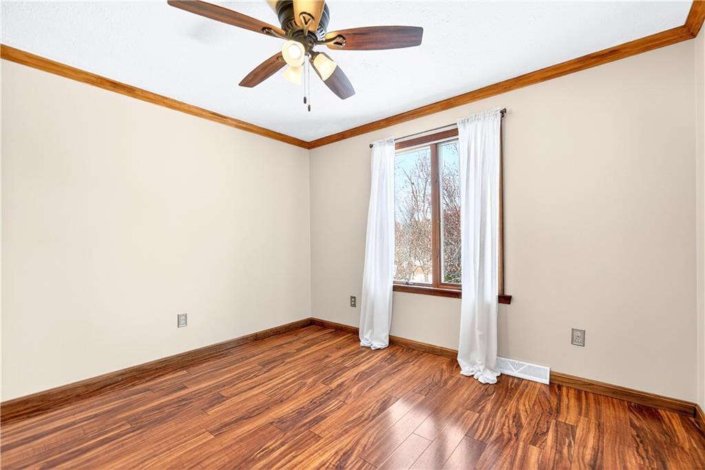 16 Ridgewood Drive McDonald, PA 15057 - Photo 35 of 47 an empty room with wooden floor chandelier fan and windows