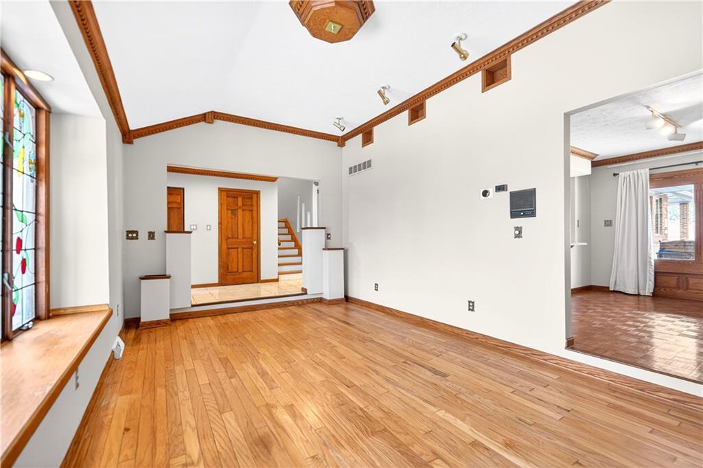 16 Ridgewood Drive McDonald, PA 15057 - Photo 4 of 47 a view of a big room with wooden floor and windows