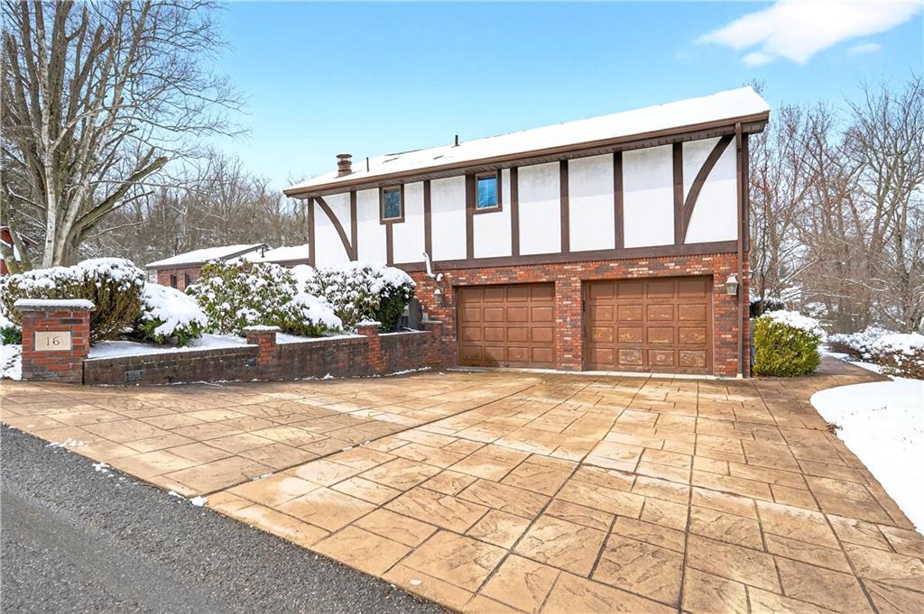 16 Ridgewood Drive McDonald, PA 15057 - Photo 43 of 47 a front view of a house with a yard and potted plants