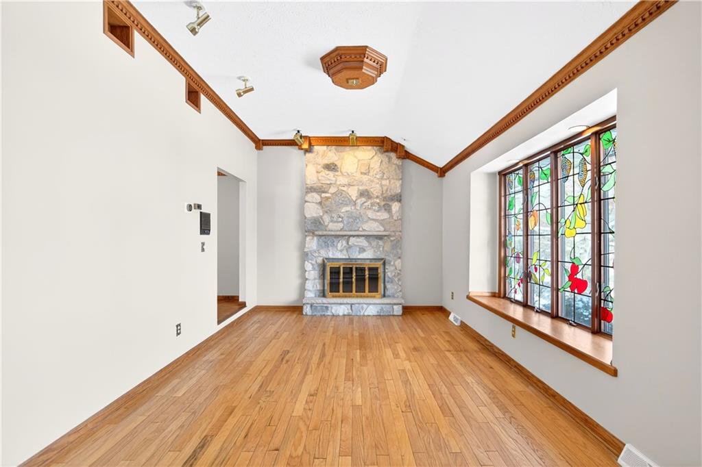 16 Ridgewood Drive McDonald, PA 15057 - Photo 6 of 47 a view of an empty room with wooden floor and windows