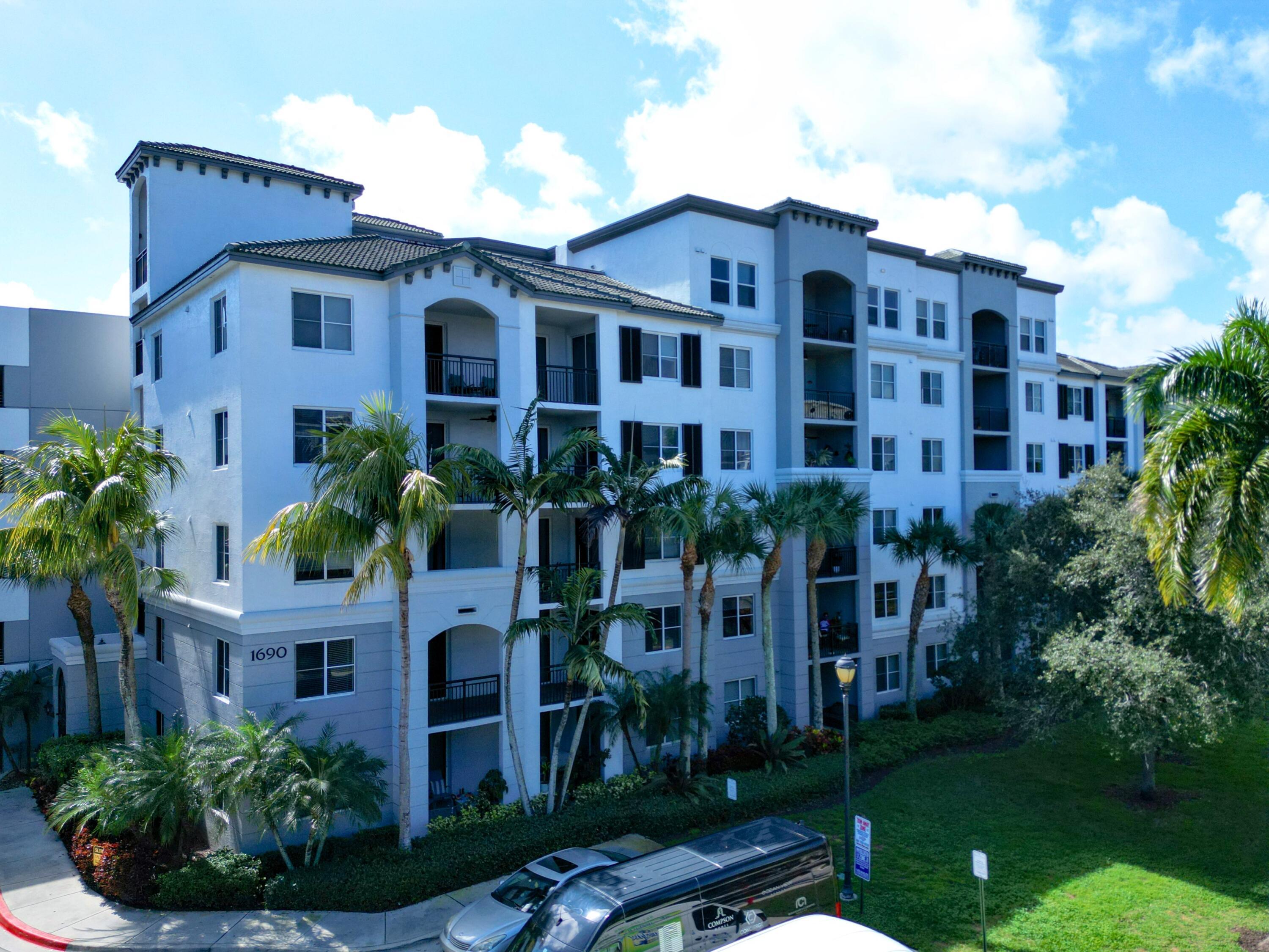 1690 Renaissance Commons Boulevard, Unit 1412 Boynton Beach, FL 33426 - Photo 27 of 49 a view of a building in the garden