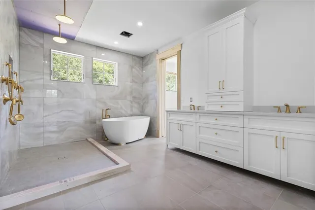 a white bath tub sitting in a bathroom
