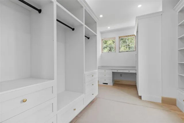 a spacious bathroom with a sink and a mirror
