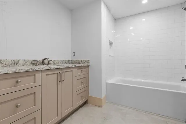 a bathroom with a sink and vanity