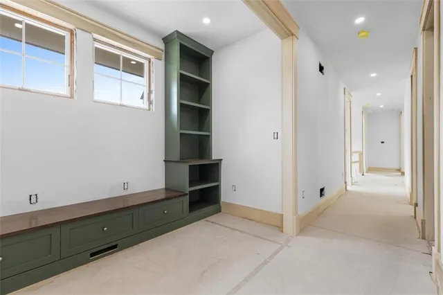 a view of an empty room with windows