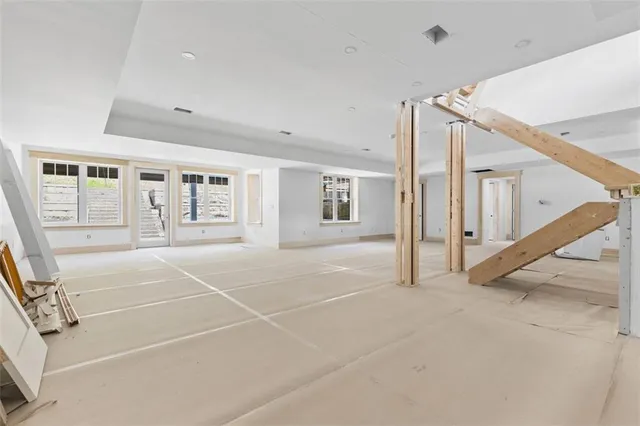 a view of a backyard with wooden floor and outdoor seating
