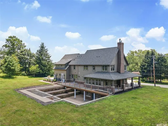 an aerial view of a house with a yard