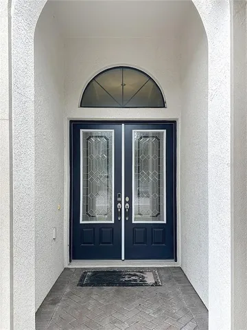 a view of a hallway with a chandelier