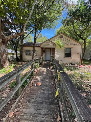 a view of a backyard with sitting area