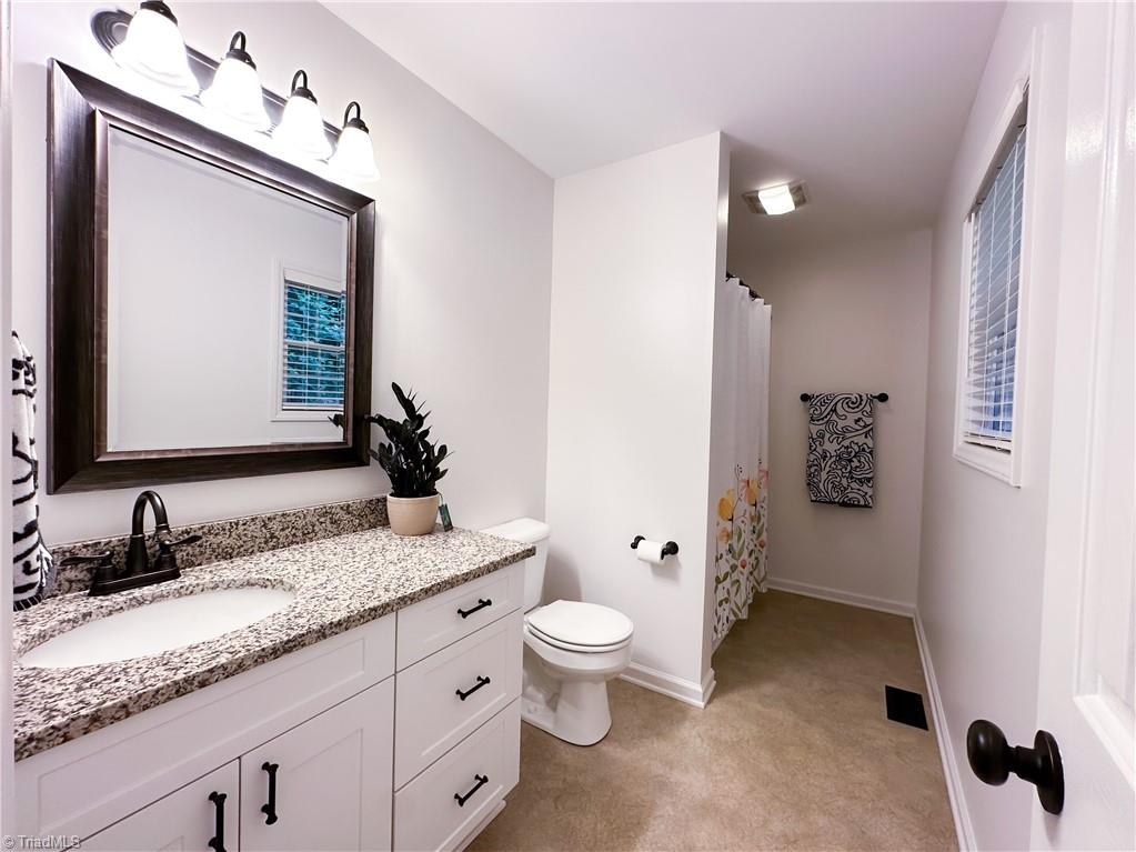 2368 W.O.W. Road Randleman, NC 27317 - Photo 20 of 31 Primary Bathroom with new Granite Countertops