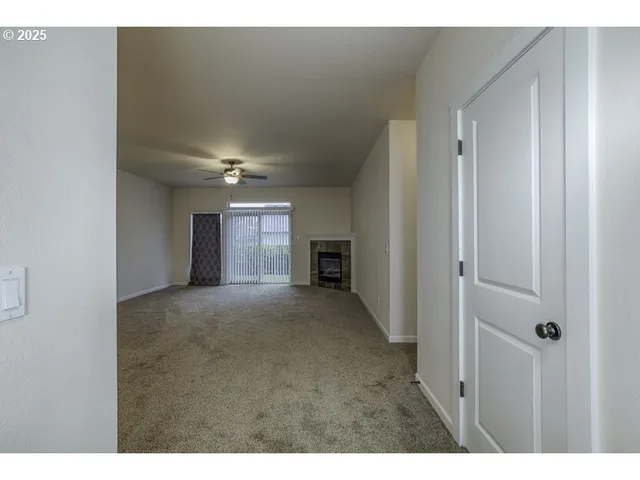 a view of a livingroom and a fireplace