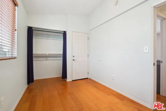 a view of empty room with closet