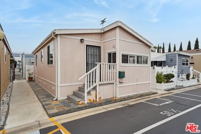 a front view of a house with a small yard