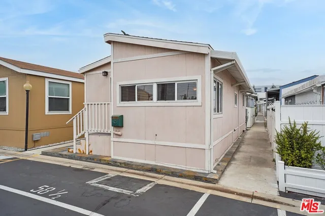 a view of a house with a street