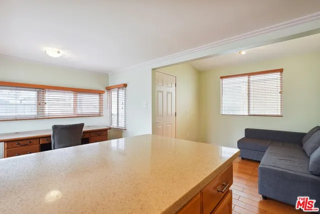 a bedroom with a large bed and a couch