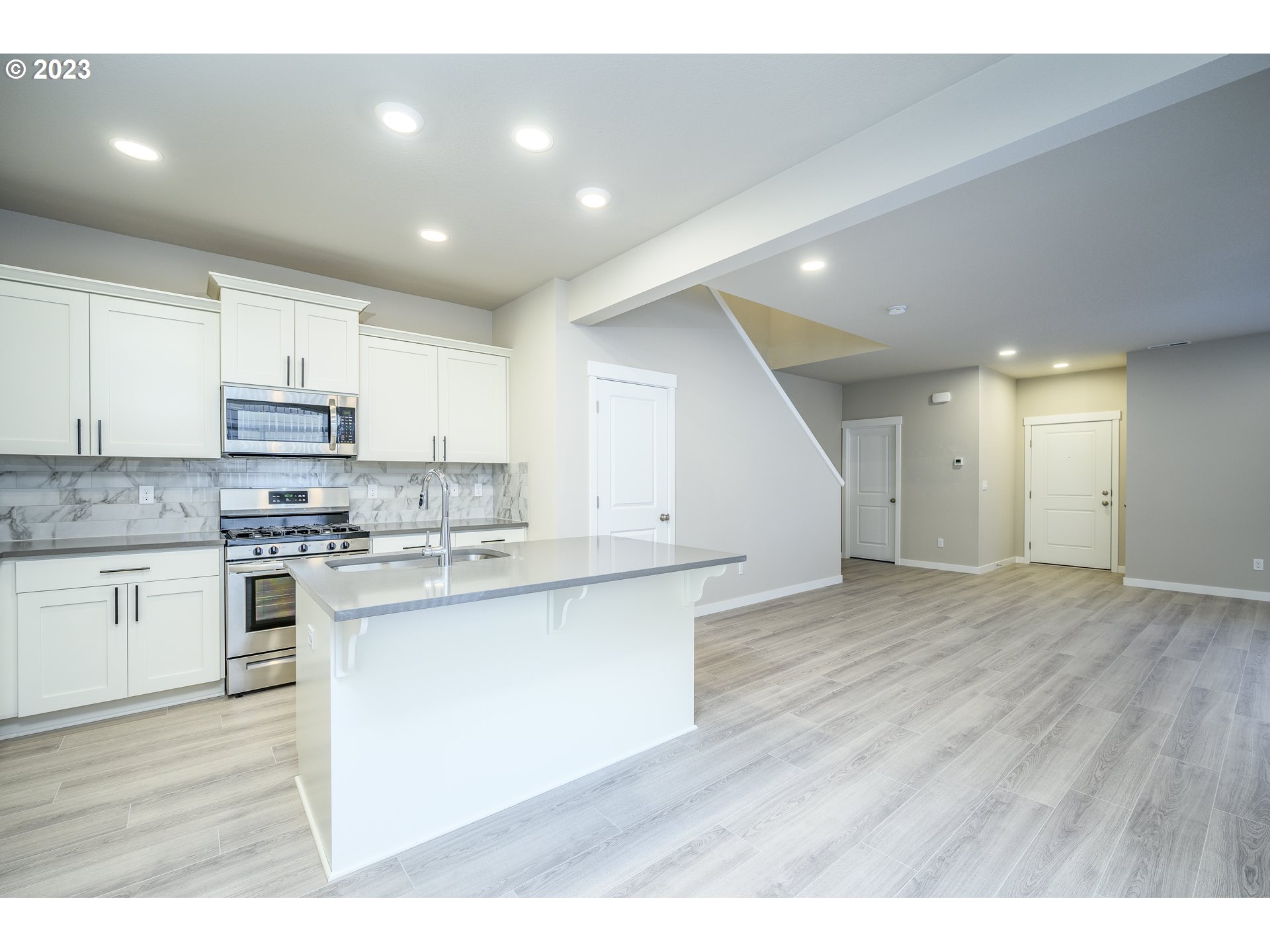 3080 South Kodiak Street, Unit LT813 Cornelius, OR 97113 - Photo 12 of 37 a kitchen with kitchen island sink stove and cabinets