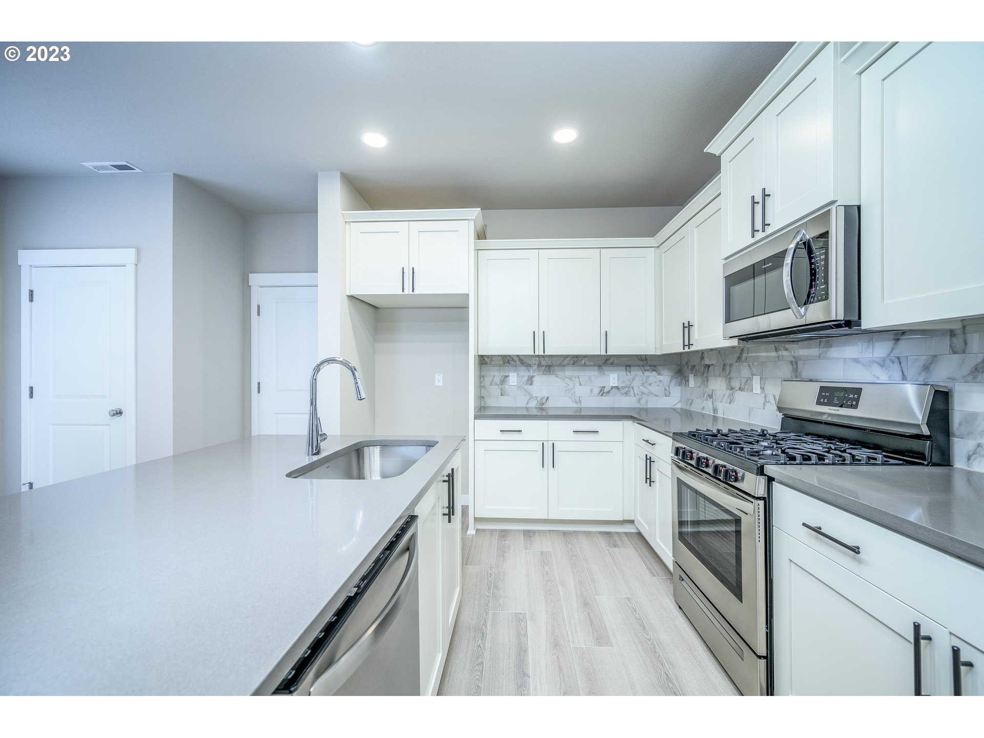 3080 South Kodiak Street, Unit LT813 Cornelius, OR 97113 - Photo 13 of 37 a kitchen with stainless steel appliances granite countertop a sink stove and cabinets
