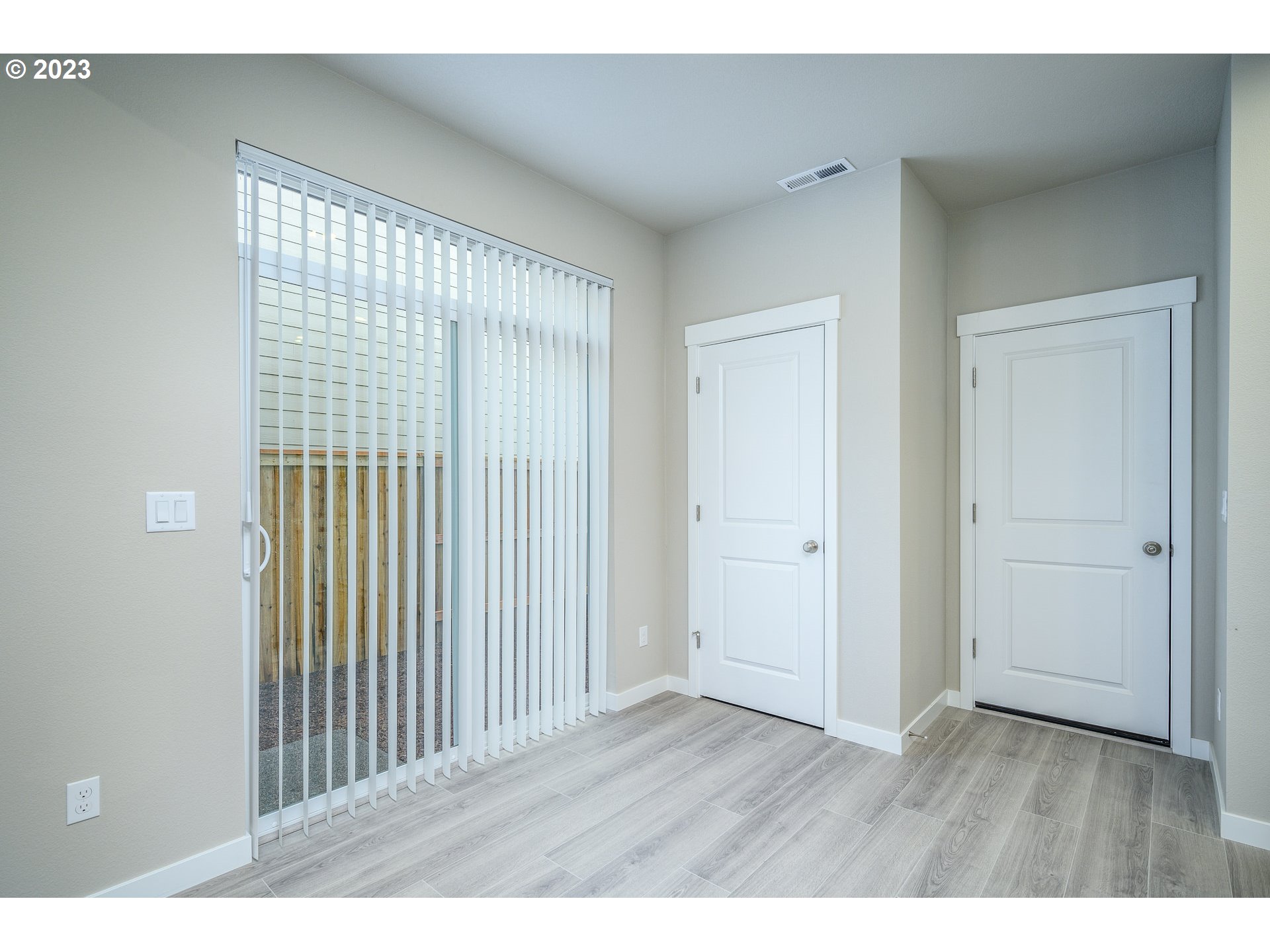 3080 South Kodiak Street, Unit LT813 Cornelius, OR 97113 - Photo 14 of 37 a view of an empty room with wooden floor