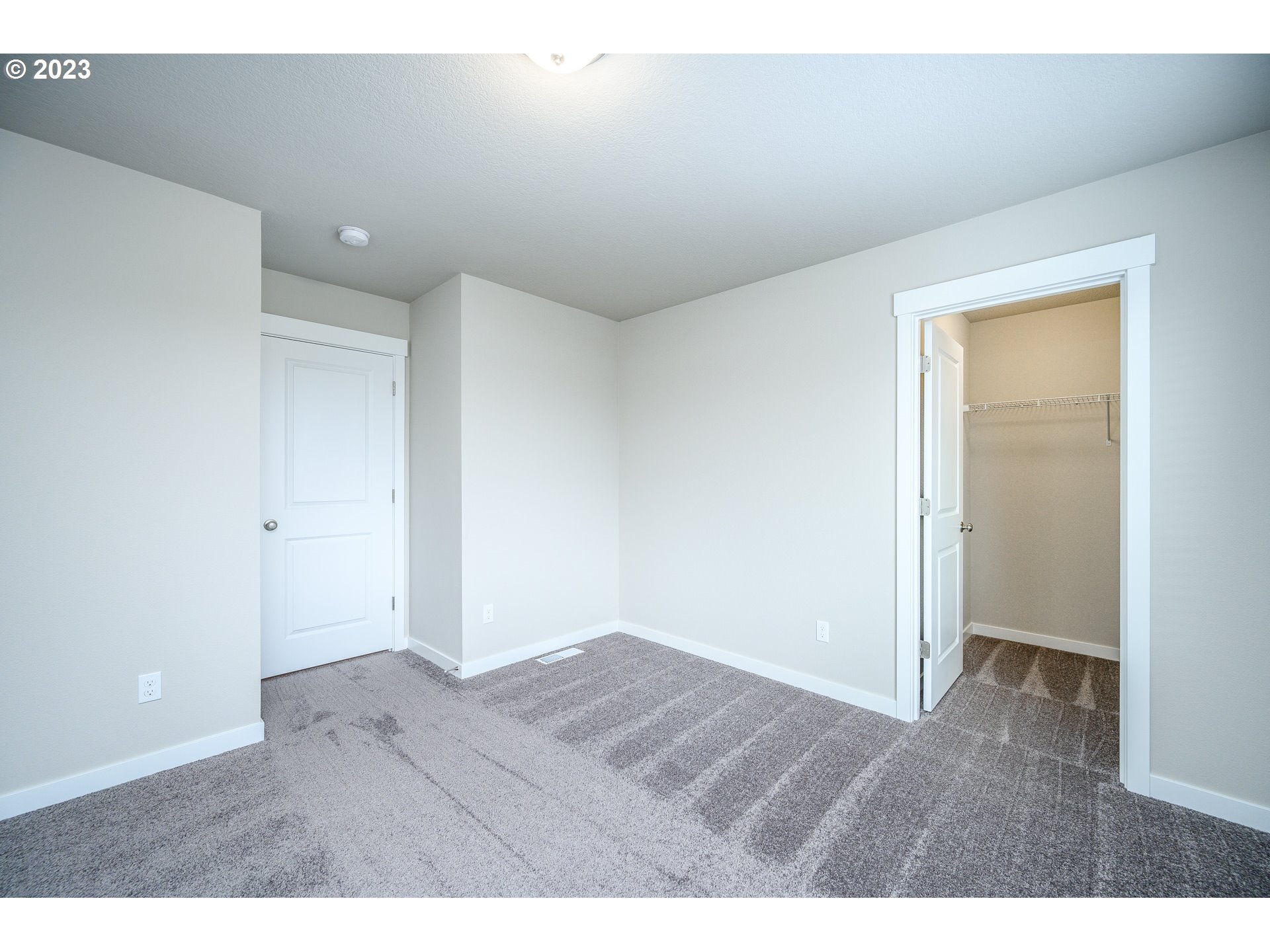 3080 South Kodiak Street, Unit LT813 Cornelius, OR 97113 - Photo 29 of 37 an empty room with wooden floor and closet