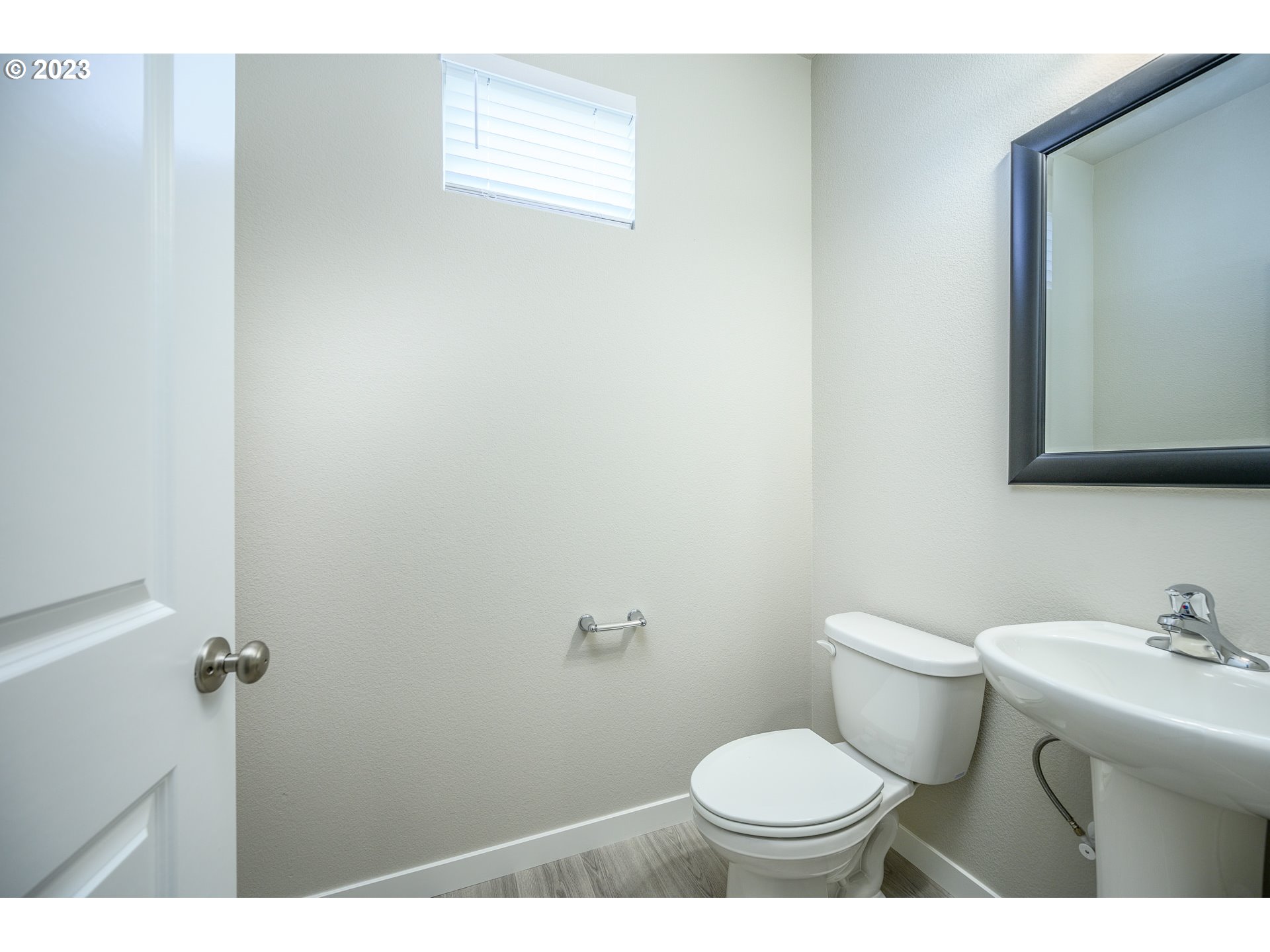 3080 South Kodiak Street, Unit LT813 Cornelius, OR 97113 - Photo 6 of 37 a bathroom with a toilet a sink and mirror