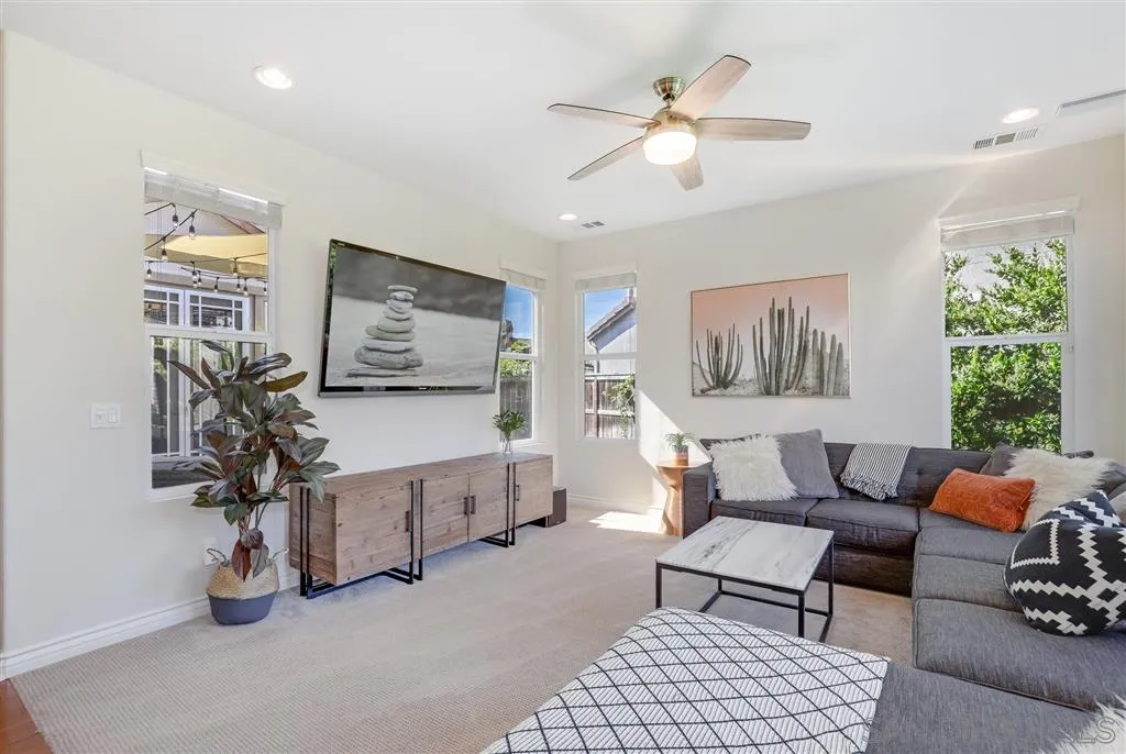 1770 Grain Mill Road San Marcos, CA 92078 - Photo 8 of 25 a living room with furniture a chandelier and a window