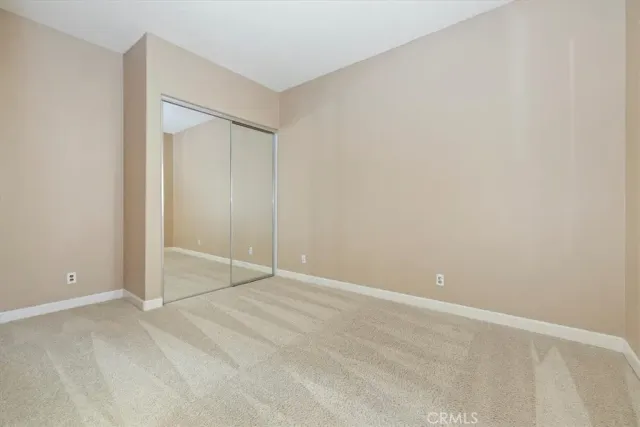 a kitchen with stainless steel appliances granite countertop a sink a stove a refrigerator and a oven