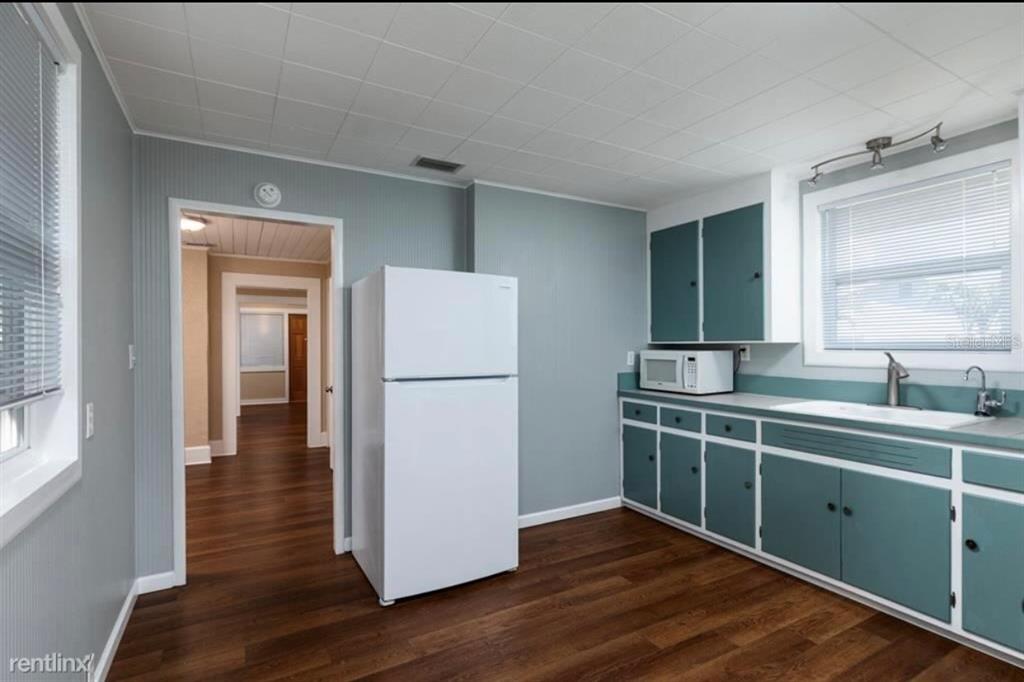 3630 38th Avenue North St. Petersburg, FL 33713 - Photo 2 of 17 a kitchen with a refrigerator and a sink