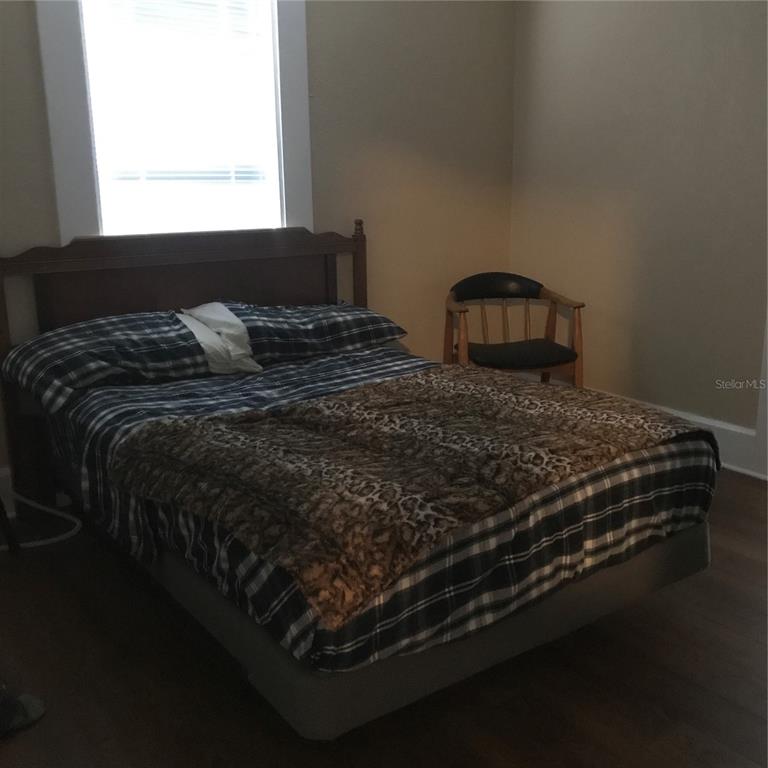 3630 38th Avenue North St. Petersburg, FL 33713 - Photo 9 of 17 a bedroom with a bed next to a window