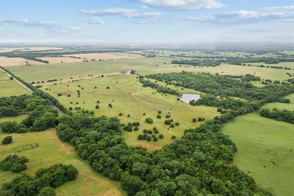 Tbd Tbd Fm-697 Whitewright, TX 75491 - Photo 9 of 19 a view of a city with a lake