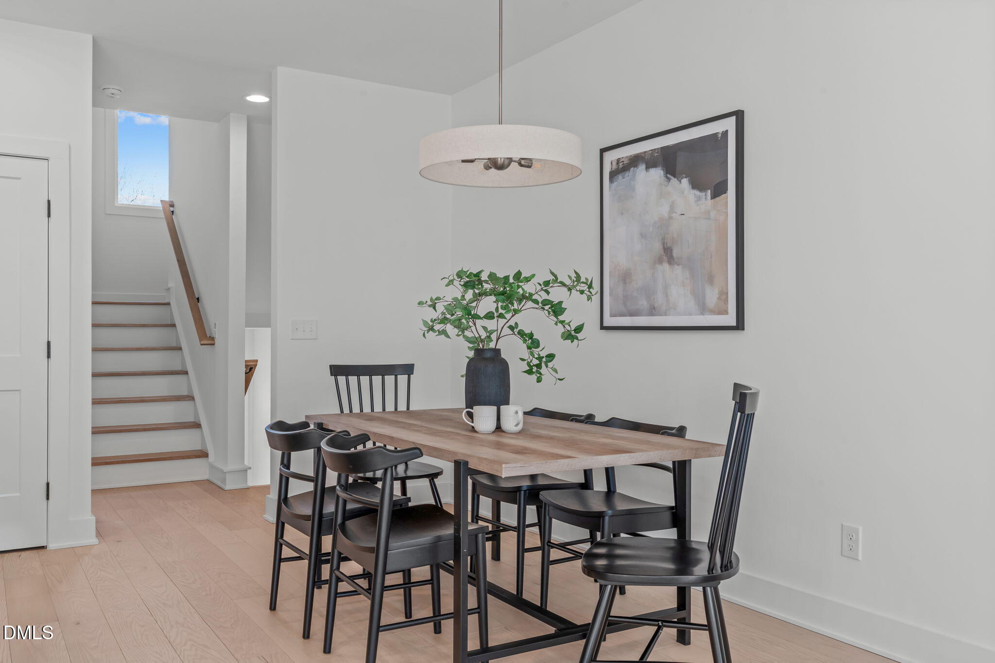 610 Rocky Knob Court Raleigh, NC 27601 - Photo 12 of 48 a dining room with furniture and wooden floor