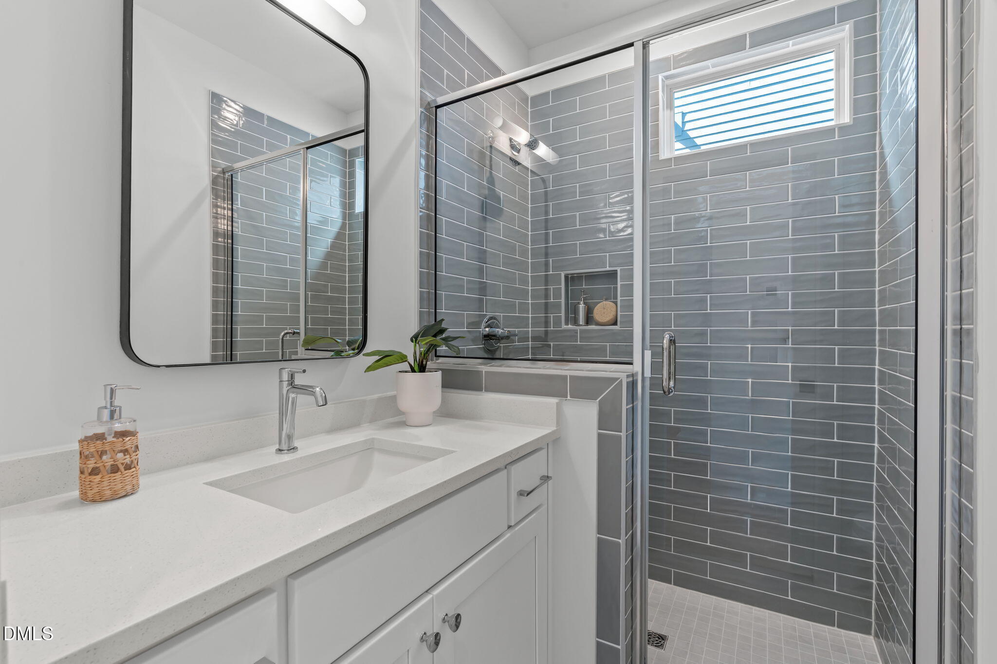 610 Rocky Knob Court Raleigh, NC 27601 - Photo 14 of 48 a bathroom with a sink and a mirror