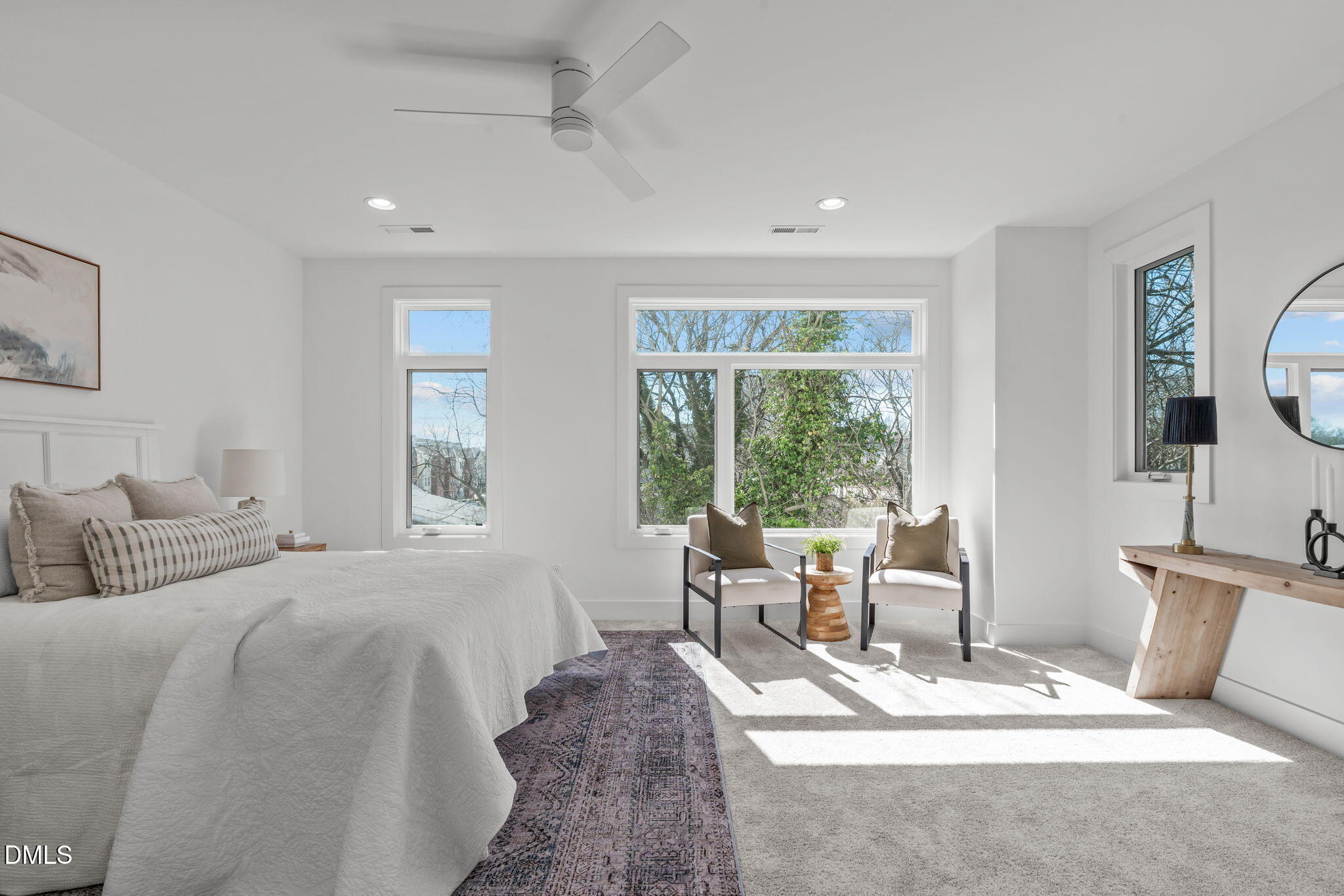 610 Rocky Knob Court Raleigh, NC 27601 - Photo 17 of 48 a spacious bedroom with a bed a table and chair