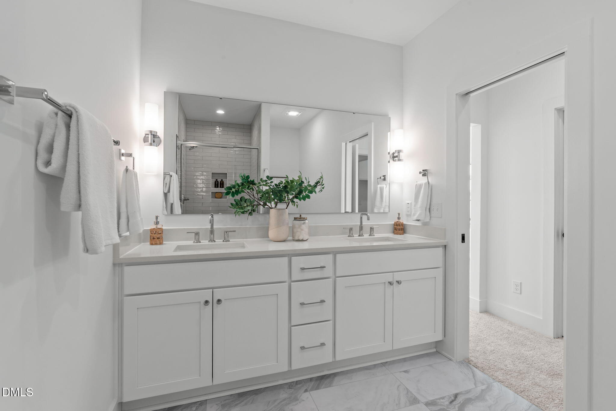 610 Rocky Knob Court Raleigh, NC 27601 - Photo 22 of 48 a bathroom with a double vanity sink and mirror