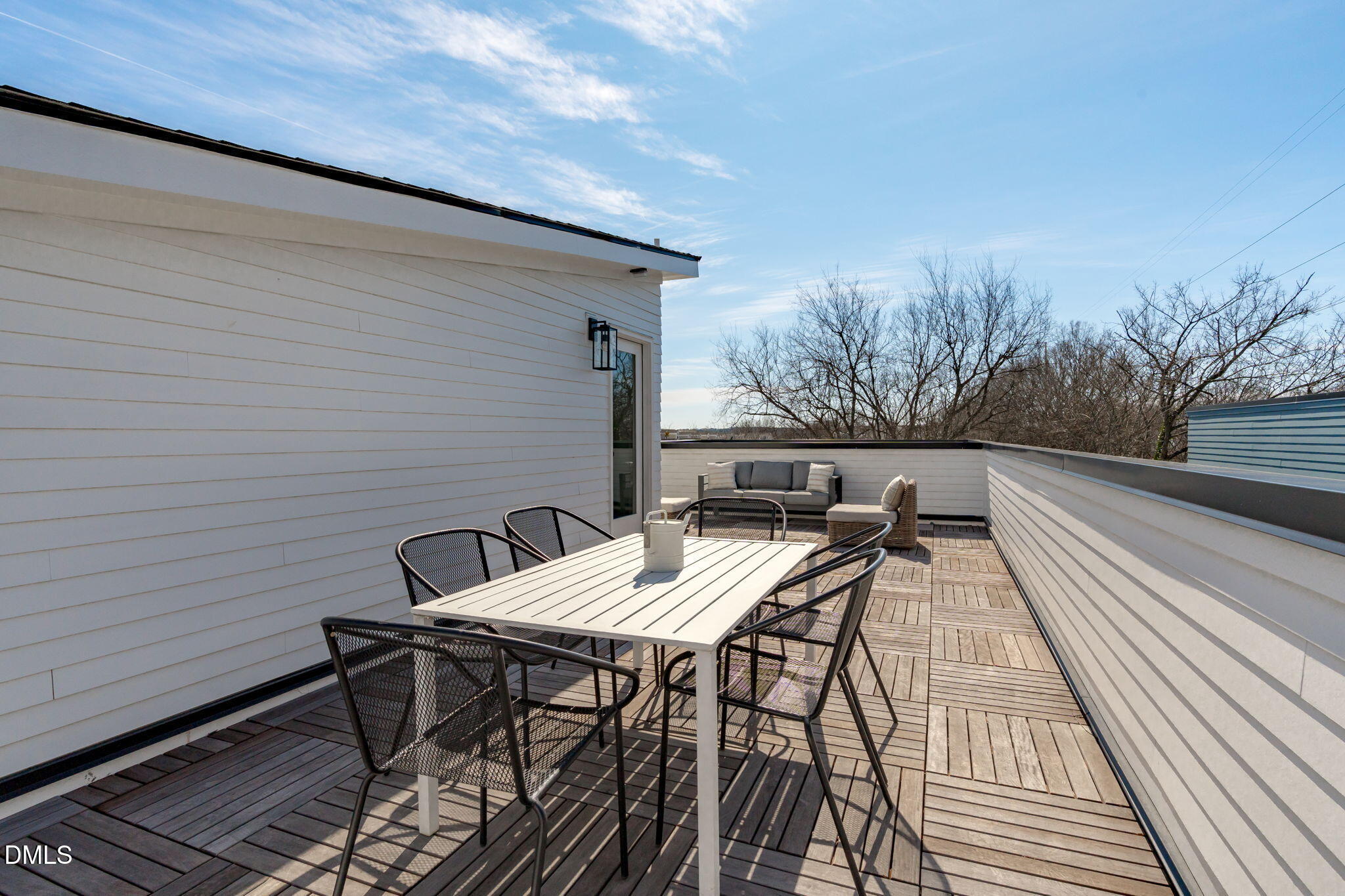 610 Rocky Knob Court Raleigh, NC 27601 - Photo 29 of 48 a view of backyard with table and chairs and wooden floor